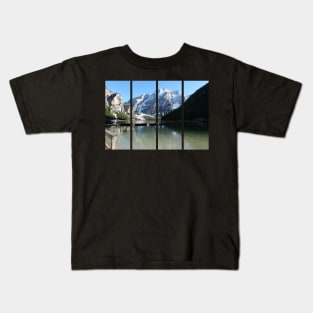 The fabulous alpine lake of Braies in the Dolomites (Bolzano). Lovely place in the Italian Alps. Boats on the water. Reflections in the water. Sunny spring day. Trentino Alto Adige Kids T-Shirt